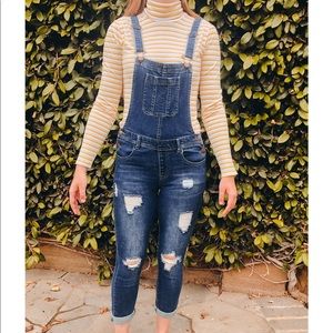 | dark blue ripped overalls
